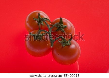 object on red - food tomato close up