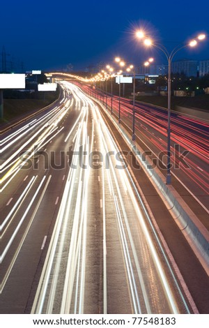 automobile lights at night on the highway
