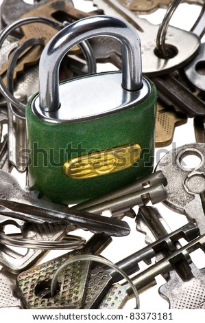 object on white - tool padlock with key close up