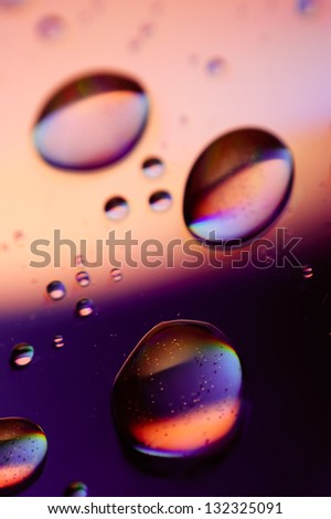 Water drops on the surface of the dvd-disc as abstract cosmic bubbles.