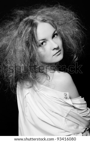 Sensual woman with fluffy hair. Black and white.