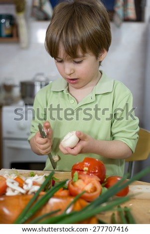 Cute Little Boy Trying Hard to Become a Great Chef