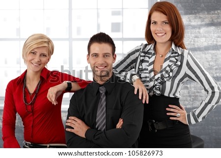 Happy smart businesspeople portrait, team posing together, smiling, looking at camera.
