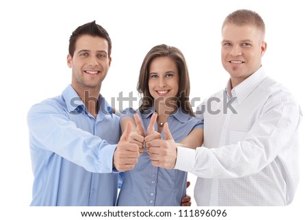 Young successful businessteam giving thumb up, smiling, team spirit, isolated on white.