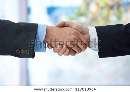 Businessmen shaking hand, closeup hands, business success, congratulation, agreement, deal.