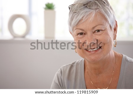 Portrait Of Smiling Senior Woman, Looking At Camera.