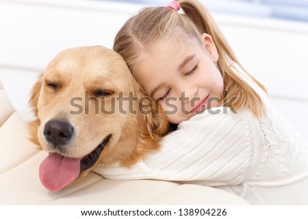 Lovely Little Girl Hugging Pet Dog With Passion, Eyes Closed.