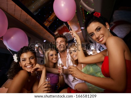 Hen Party In Limousine With Attractive Young People.
