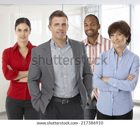 Diverse team of smiling office workers. Boss and employees of successful casual small business.
