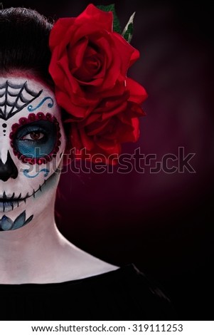 Half portrait of woman in professional makeup for halloween.