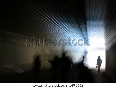 Human figures are walking towards the glowing entrance of a dark passage