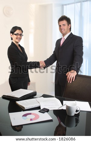 Young business people are shaking hands after a business deal.