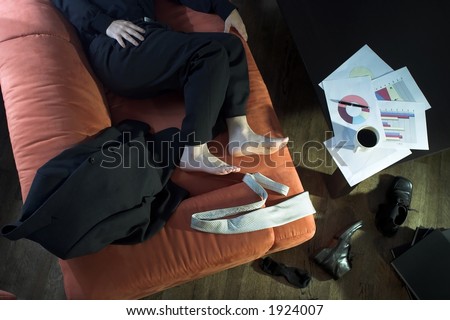 Businessman takes a break on the couch.