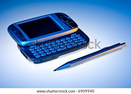 Equipment of business people: PDA and pen.