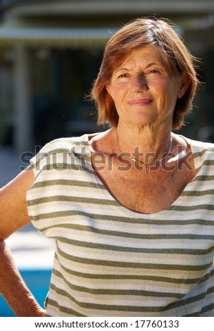 Portrait of a happy and healthy active senior woman, smiling, outdoor.