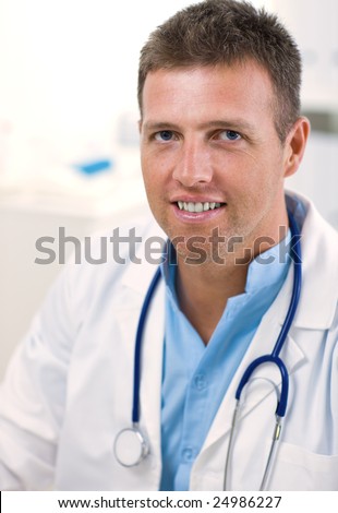 Portrait of medical professional at doctors room, smiling.