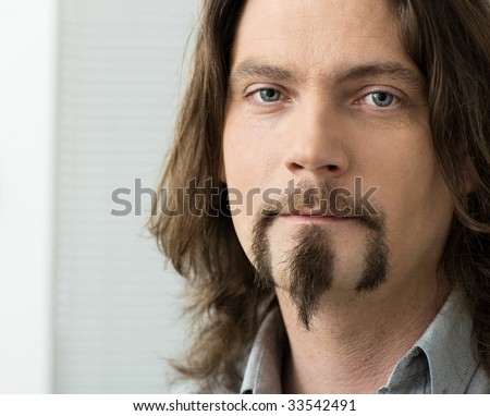 Man With Long Hair And Beard. looking man with long hair