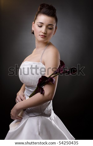 stock photo Studio portrait of a bride posing in a white wedding dress 