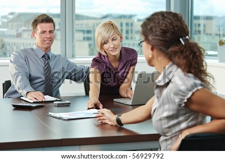 Young business people planning on table at office during business meeting.