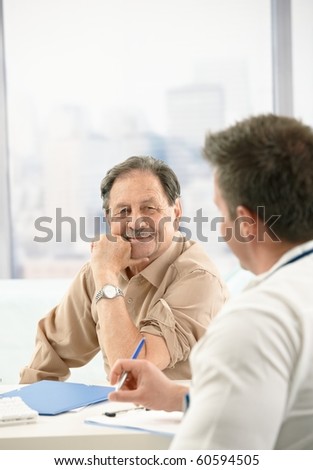 Smiling elderly patient sitting at doctor\'s office on consultation.?