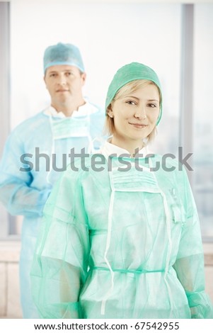 Portrait of smiling surgeons wearing scrub suit.?