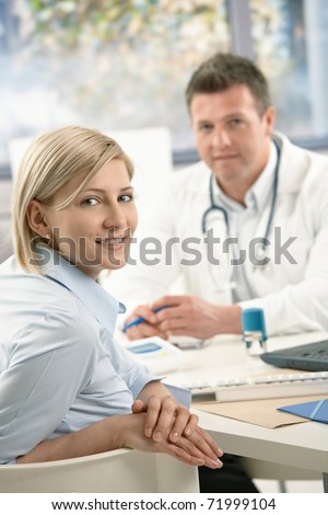 Portrait of patient at doctor's office, smiling at camera.?