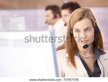 Portrait of beautiful female dispatcher working in call center.?