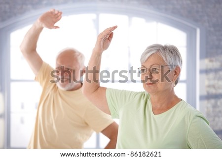 Old couple doing exercises in the gym.?
