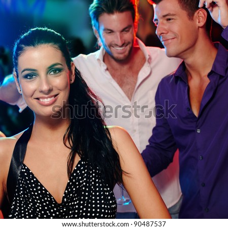 Beautiful young woman and friends having fun in nightclub.?