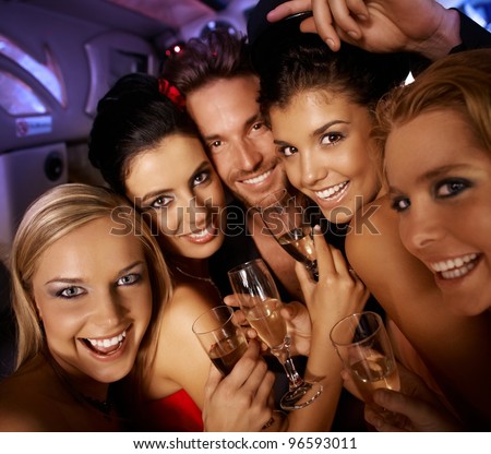 Young attractive people having party fun, drinking, laughing.?
