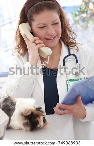 Veterinarian informs pet owner by phone.