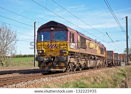 WYMONDLEY, UK - APR 6: An empty Euro Cargo Rail freight train travels northward on the ECML on April 6, 2011 in Wymondley.