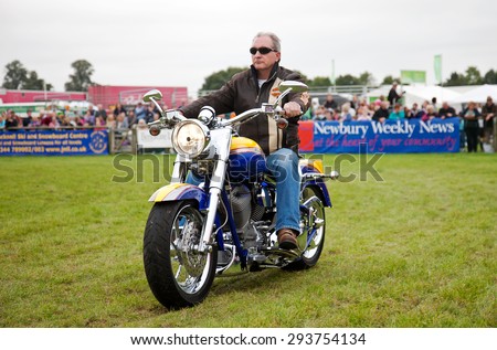 NEWBURY, UK - SEPTEMBER 21: Members of a local Oxfordshire Harley Davidson motorcycle owners club parade around the main arena for the public at the Berks County show on September 21, 2013 in Newbury