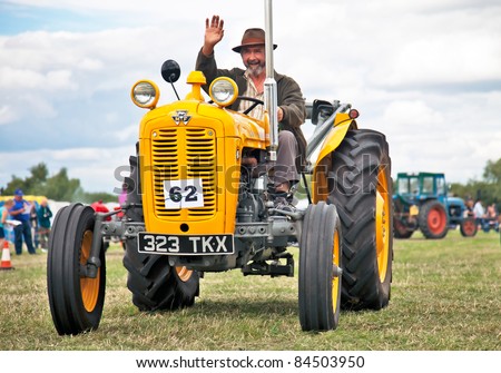 SHABBINGTON, UNITED KINGDOM - AUGUST 6: Massey Ferguson tractor, model TEF20,  parading through the show ring at the Shabbington Steam & Country fair on August 6, 2011 at Shabbington, UK.