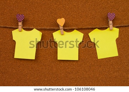 Cork board with three yellow notes.