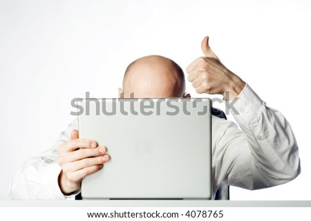 stock-photo-bald-businessman-giving-the-thumbs-up-signal-while-hunkering-behind-laptop-computer-white-4078765.jpg