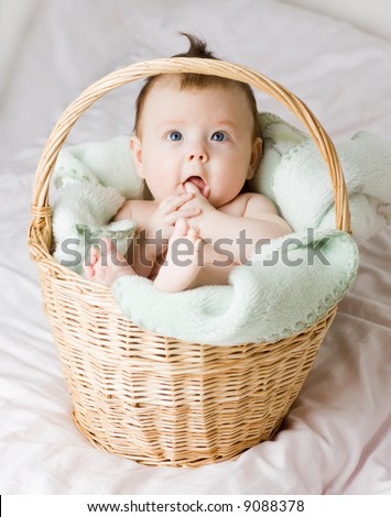  caucasian white baby girl portrait with cute facial expression lying in