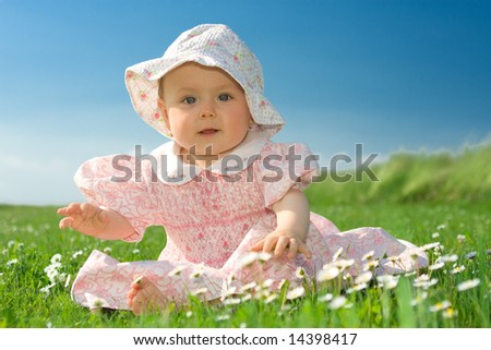 Beautiful Baby Girl Clothes on Beautiful Baby Girl Wearing Bonnet Sat In Field Of Flowers Under Blue