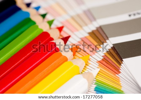 A rainbow of colored pencils with color chips.