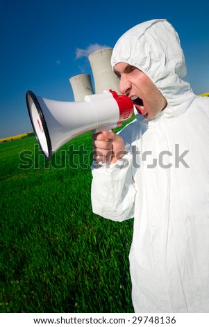 An environment protester shouting slogans through a loud-speaker against the pollution of nuclear power plants.