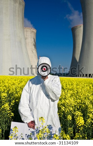 Environment activist with a loudspeaker protesting against a nuclear plant installation.