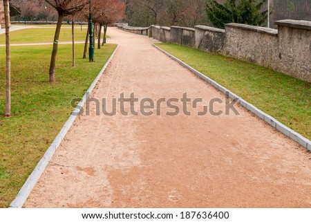 Red gravel path in the park