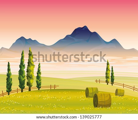Morning autumn landscape with flowering green field, cypress trees and mountains with fog on a pink sky background
