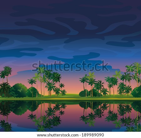 Tropical landscape with sunset sky and coconat palms near the lake.