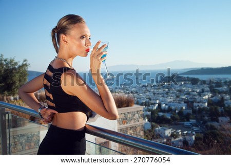 Beautiful Girl is Drinking Martini
