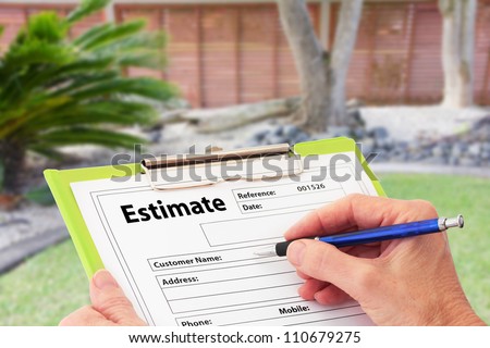 Hand writing an estimate on a clipboard for Garden Maintenance