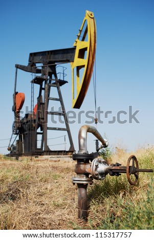 Oil pump and close-up of pipe to trasport the petrol