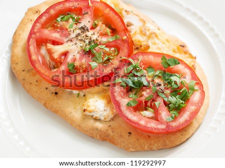 Little French loaf with cheese and tomato, Mediterranean food