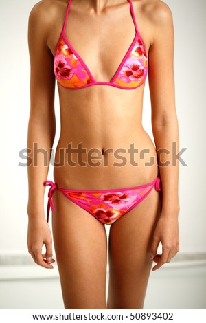 Young girl body in purple bikini swimsuit