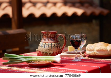 Traditional Bulgarian food wine, saussage, yellow cheese and garlic